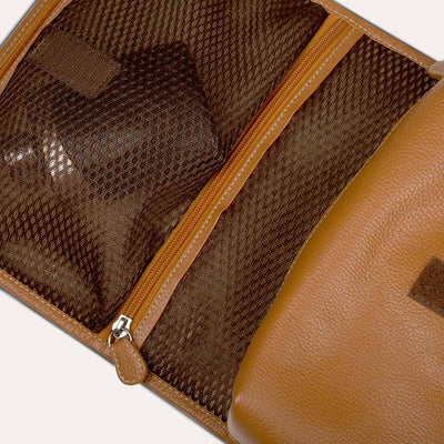 Caspar men's toiletry kit with multiple pockets and coated metal clasps. Shop at pauladamsworld.com.