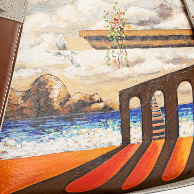 Rhea leather handbag with original hand-painted Surrealist art on canvas. Shop at Paul Adams world.